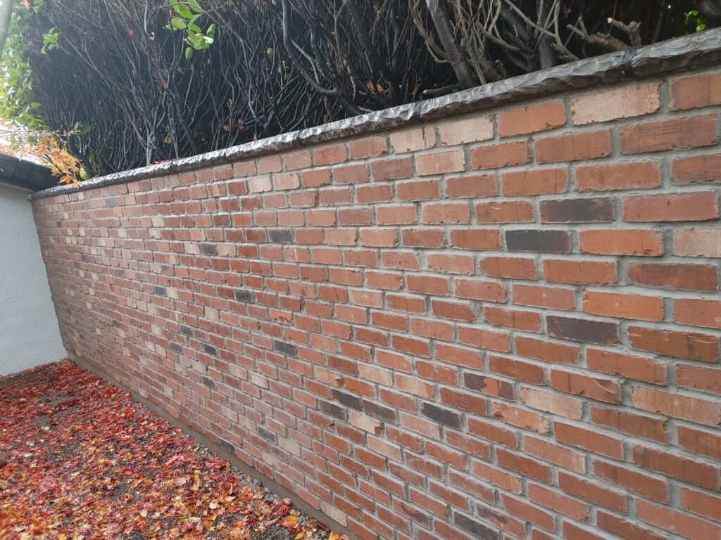 Expertly laid red brick wall with precise mortar joints in Silverton, Oregon.
